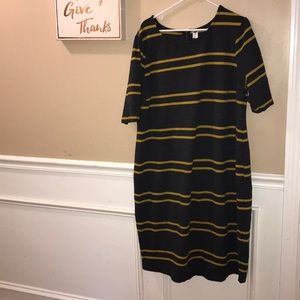 Woman’s yellow and grey stripped dress